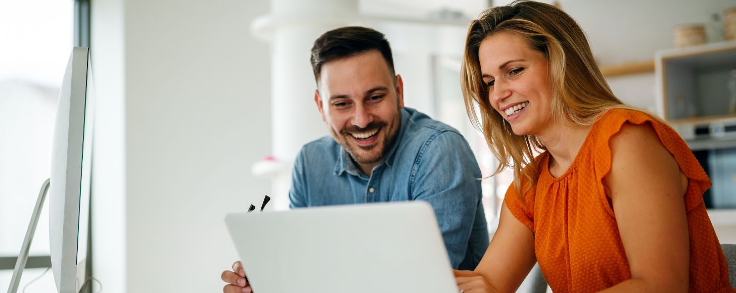 financial advisors looking at laptop